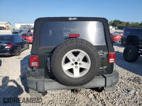 2012 Jeep Wrangler Sport with VIN 1C4AJWAG4CL116725, listed as a Copart auction lot 86132875 with 100,075 mi miles and Salvage title. Bid and sale history available at DreamBid. Image 6.