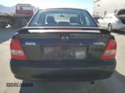 ✅ 2000 Mazda Protege DX • VIN: JM1BJ2220Y0239835 • Lot: 80228864. Wystawiony na Copart z przebiegiem 200 936 mil. Bezpłatny archiwum sprzedaży aukcyjnych z USA i szczegółowy raport historii pojazdu na DreamBid. Zdjęcie 6.