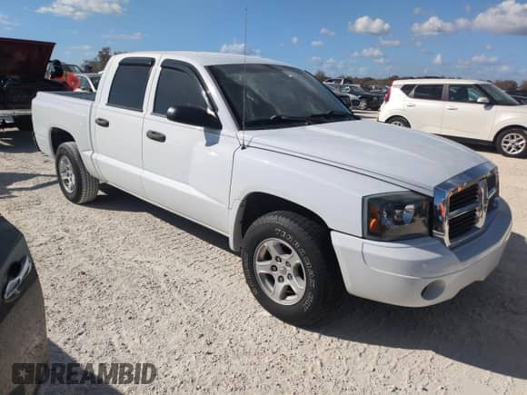 2006 Dodge Dakota SLT z VIN 1D7HE48NX6S636343, wystawiony jako Copart lot #77351904 z przebiegiem Nie podano mil oraz Szkoda całkowita • Salvage title. Historia ofert i sprzedaży dostępna na DreamBid. Obrazek 4.