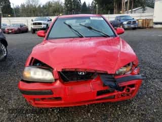 2004 Hyundai Elantra GT z VIN KMHDN56D34U104583, wystawiony jako Copart lot #82441094 z przebiegiem Nie podano mil oraz Szkoda całkowita • Salvage title. Historia ofert i sprzedaży dostępna na DreamBid. Obrazek 5.