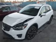 ✅ 2016 Mazda CX-5 Grand Touring • VIN: JM3KE2DY3G0863303 • Lot: 43848862. Wystawiony na IAAI z przebiegiem 95 498 mil. Bezpłatny archiwum sprzedaży aukcyjnych z USA i szczegółowy raport historii pojazdu na DreamBid. Zdjęcie 17.