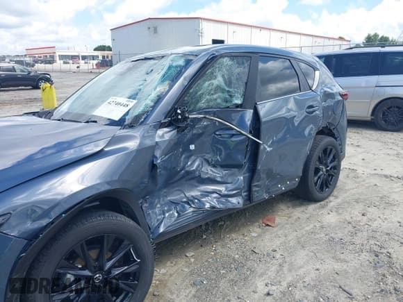 ✅ 2023 Mazda CX-5 S Carbon Edition • VIN: JM3KFBCM3P0262534 • Лот: 42740448. Опубликован ранее на IAAI с пробегом 10 257 миль. Бесплатный доступ к архиву аукционных продаж из США и подробный отчёт об истории автомобиля на DreamBid. Изображение 6.