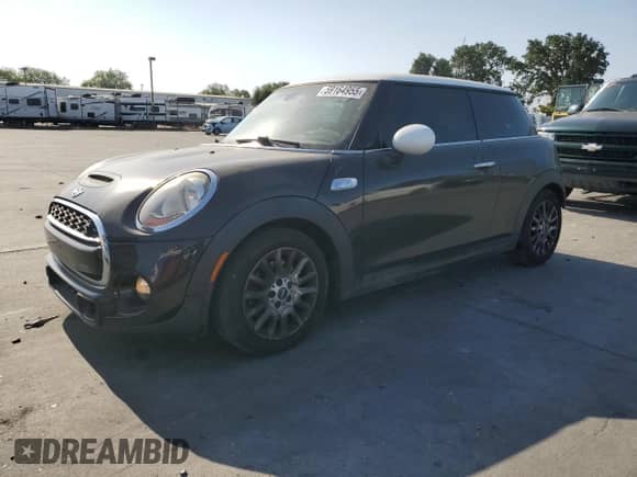 2014 MINI Hardtop S with VIN WMWXM7C59ET987820, listed as a Copart auction lot 59164955 with 77,699 mi miles and Salvage title. Bid and sale history available at DreamBid. Image 1.