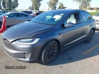 ✅ 2017 Tesla Model X 90D • VIN: 5YJXCBE21HF067442 • Lot: 43323982. Listed on IAAI with 105,435 mi. Free auction sales archive from the USA and detailed vehicle history report at DreamBid. Image 2.