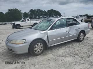 2001 Honda Accord EX z VIN 1HGCG56621A117576, wystawiony jako Copart lot #59602775 z przebiegiem Nie podano mil oraz Szkoda całkowita • Salvage title. Historia ofert i sprzedaży dostępna na DreamBid. Obrazek 1.