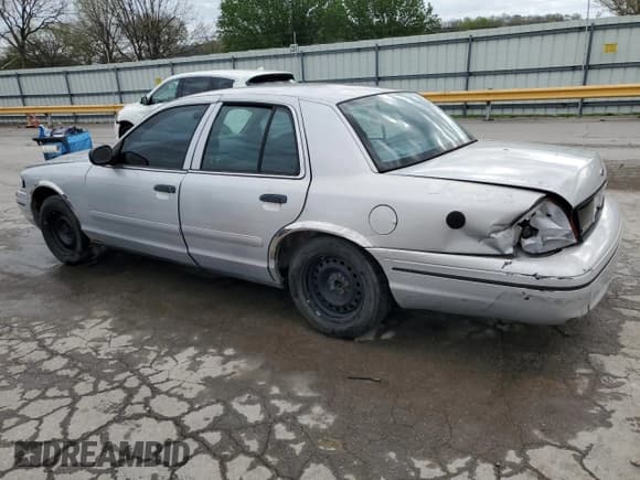 ✅ 2000 Ford Crown Victoria Police Interceptor • VIN: 2FAFP71W5YX167880 • Лот: 51815355. Опубликован ранее на Copart с пробегом 207 868 миль. Бесплатный доступ к архиву аукционных продаж из США и подробный отчёт об истории автомобиля на DreamBid. Изображение 2.