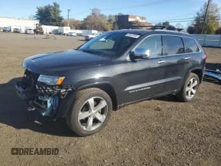 ✅ 2015 Jeep Grand Cherokee Overland • VIN: 1C4RJFCG0FC121411 • Lot: 89823465. Wystawiony na Copart z przebiegiem 128 179 mil. Bezpłatny archiwum sprzedaży aukcyjnych z USA i szczegółowy raport historii pojazdu na DreamBid. Zdjęcie 1.