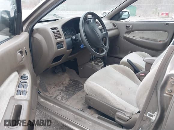 ✅ 1997 Mazda Protege DX • VIN: JM1BC141XV0166395 • Лот: 41541808. Опубликован ранее на IAAI с пробегом Не указан. Бесплатный доступ к архиву аукционных продаж из США и подробный отчёт об истории автомобиля на DreamBid. Изображение 5.