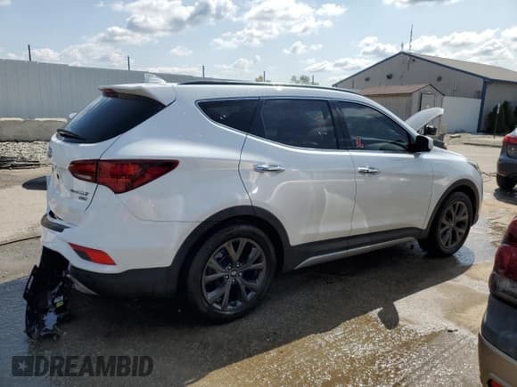 ✅ 2018 Hyundai Santa Fe Ultimate • VIN: 5XYZW4LA1JG549574 • Лот: 67154294. Опубликован ранее на Copart с пробегом Не указан. Бесплатный доступ к архиву аукционных продаж из США и подробный отчёт об истории автомобиля на DreamBid. Изображение 3.