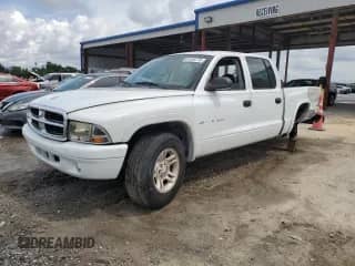 2002 Dodge Dakota Sport с VIN 1B7HL38X12S640531, выставлен на аукционе Copart как лот 81258775 с пробегом 210 552 миль миль и Списание • Salvage title. История ставок и продаж доступна на DreamBid. Изображение 1.