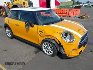✅ 2014 MINI Hardtop S • VIN: WMWXM7C56ET985474 • Lot: 43115913. Listed on IAAI with 62,550 mi. Free auction sales archive from the USA and detailed vehicle history report at DreamBid. Image 1.