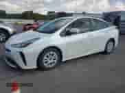 2021 Toyota Prius L Eco with VIN JTDKAMFU9M3139796, listed as a Copart auction lot 71665595 with 89,976 mi miles and Salvage title. Bid and sale history available at DreamBid. Image 1.