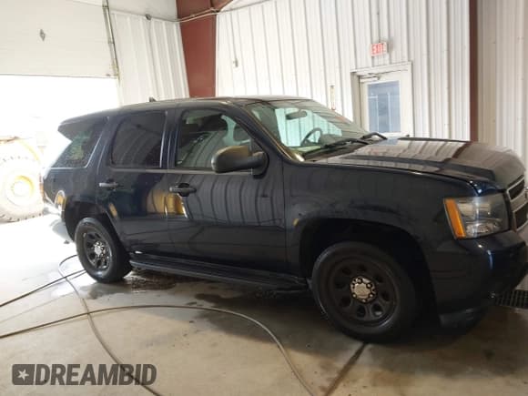 ✅ 2014 Chevrolet Tahoe Commercial • VIN: 1GNLC2E07ER213191 • Lot: 43243599. Listed on IAAI with 141,185 mi. Free auction sales archive from the USA and detailed vehicle history report at DreamBid. Image 12.
