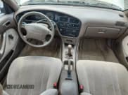 ✅ 1993 Toyota Camry DLX • VIN: 4T1SK11E6PU180747 • Lot: 64990075. Wystawiony na Copart z przebiegiem 109 692 mil. Bezpłatny archiwum sprzedaży aukcyjnych z USA i szczegółowy raport historii pojazdu na DreamBid. Zdjęcie 8.