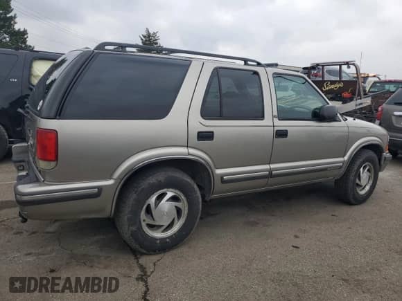 1999 Chevrolet Blazer LS with VIN 1GNDT13W9X2193172, listed as a Copart auction lot 85622594 with 160,054 mi miles and Salvage title. Bid and sale history available at DreamBid. Image 3.