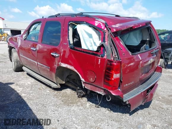 2011 Chevrolet Tahoe LTZ with VIN 1GNSKCE0XBR158736, listed as a IAAI auction lot 42355880 with 288,518 mi miles and . Bid and sale history available at DreamBid. Image 3.