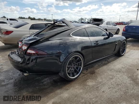 ✅ 2011 Jaguar XK XKR • VIN: SAJWA4DCXBMB39622 • Lot: 79881914. Listed on Copart with 61,163 mi. Free auction sales archive from the USA and detailed vehicle history report at DreamBid. Image 3.