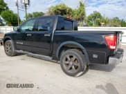 ✅ 2015 Nissan Titan Pro-4X • VIN: 1N6BA0EC3FN507640 • Lot: 63861755. Listed on Copart with 145,365 mi. Free auction sales archive from the USA and detailed vehicle history report at DreamBid. Image 2.