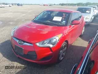 2013 Hyundai Veloster w/Gray Int z VIN KMHTC6AD6DU167563, wystawiony jako IAAI lot #43296088 z przebiegiem 146 703 mil mil oraz . Historia ofert i sprzedaży dostępna na DreamBid. Obrazek 2.