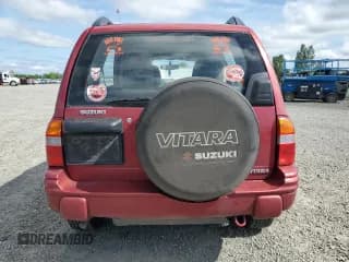 ✅ 1999 Suzuki Vitara JX • VIN: 2S3TD52V9X6101435 • Lot: 57801905. Wystawiony na Copart z przebiegiem 82 346 mil. Bezpłatny archiwum sprzedaży aukcyjnych z USA i szczegółowy raport historii pojazdu na DreamBid. Zdjęcie 6.