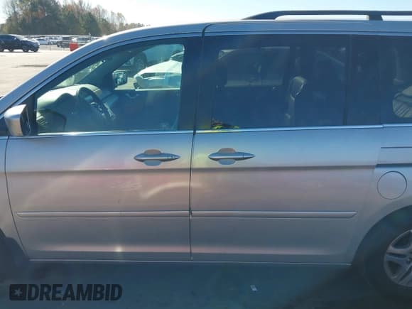 ✅ 2005 Honda Odyssey EX-L • VIN: 5FNRL38655B036820 • Lot: 43633450. Listed on IAAI with 207,568 mi. Free auction sales archive from the USA and detailed vehicle history report at DreamBid. Image 14.