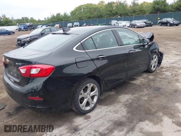 ✅ 2018 Chevrolet Cruze Premier • VIN: 1G1BF5SM1J7141701 • Lot: 43449111. Listed on IAAI with 128,825 mi. Free auction sales archive from the USA and detailed vehicle history report at DreamBid. Image 4.