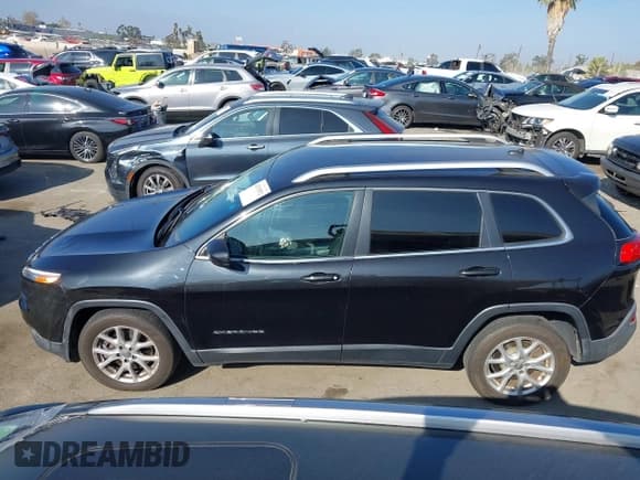 ✅ 2014 Jeep Cherokee Latitude • VIN: 1C4PJLCS0EW154674 • Lot: 43335552. Listed on IAAI with 133,099 mi. Free auction sales archive from the USA and detailed vehicle history report at DreamBid. Image 14.