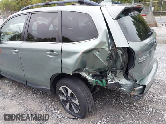 2018 Subaru Forester Limited with VIN JF2SJAJC7JH599214, listed as a IAAI auction lot 43324463 with 87,024 mi miles and . Bid and sale history available at DreamBid. Image 6.