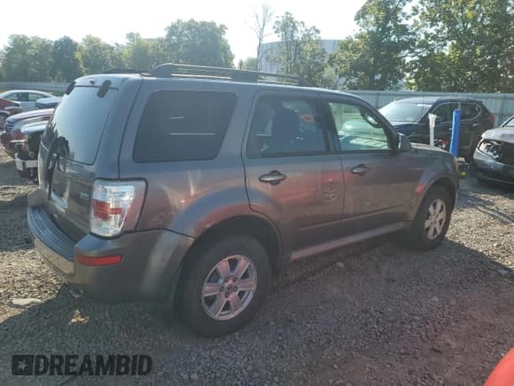 ✅ 2010 Mercury Mariner • VIN: 4M2CN9BG0AKJ07403 • Lot: 80071025. Listed on Copart with 128,074 mi. Free auction sales archive from the USA and detailed vehicle history report at DreamBid. Image 3.