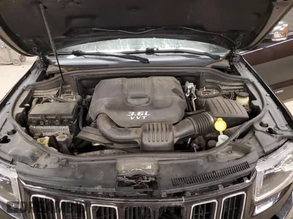 2014 Jeep Grand Cherokee Limited z VIN 1C4RJFBGXEC204652, wystawiony jako Copart lot #80250105 z przebiegiem Nie podano mil oraz Szkoda całkowita • Salvage title. Historia ofert i sprzedaży dostępna na DreamBid. Obrazek 12.