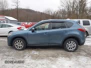 ✅ 2016 Mazda CX-5 Touring • VIN: JM3KE4CY6G0874938 • Lot: 43869585. Listed on IAAI with 180,000 mi. Free auction sales archive from the USA and detailed vehicle history report at DreamBid. Image 14.