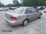 ✅ 1999 Toyota Corolla VE • VIN: 2T1BR12E3XC246635 • Lot: 42910962. Listed on IAAI with 252,704 mi. Free auction sales archive from the USA and detailed vehicle history report at DreamBid. Image 4.