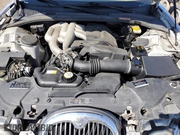 ✅ 2003 Jaguar S-Type • VIN: SAJEA01T33FM59487 • Лот: 80666965. Опубликован ранее на Copart с пробегом 59 700 миль. Бесплатный доступ к архиву аукционных продаж из США и подробный отчёт об истории автомобиля на DreamBid. Изображение 11.