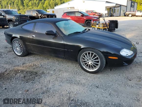 ✅ 1998 Jaguar XK • VIN: SAJGX5240WC025982 • Lot: 63363405. Listed on Copart with 60,641 mi. Free auction sales archive from the USA and detailed vehicle history report at DreamBid. Image 4.