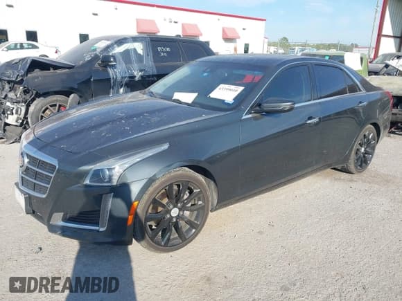 ✅ 2014 Cadillac CTS Luxury RWD • VIN: 1G6AR5SX5E0193905 • Lot: 43399010. Listed on IAAI with 115,555 mi. Free auction sales archive from the USA and detailed vehicle history report at DreamBid. Image 2.
