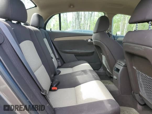 2010 Chevrolet Malibu 1LS z VIN 1G1ZB5E02AF262603, wystawiony jako Copart lot #57138915 z przebiegiem 128 992 mil mil oraz Szkoda całkowita • Salvage title. Historia ofert i sprzedaży dostępna na DreamBid. Obrazek 10.