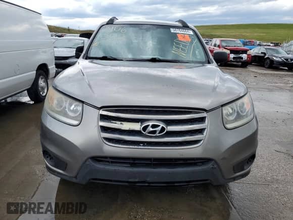 2012 Hyundai Santa Fe GLS с VIN 5XYZGDAB0CG157178, выставлен на аукционе Copart как лот 58784664 с пробегом 166 163 миль миль и Списание • Salvage title. История ставок и продаж доступна на DreamBid. Изображение 5.