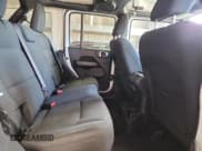 ✅ 2018 Jeep Wrangler Unlimited Sahara • VIN: 1C4HJXEG6JW216240 • Лот: 81991285. Опубликован ранее на Copart с пробегом 87 608 миль. Бесплатный доступ к архиву аукционных продаж из США и подробный отчёт об истории автомобиля на DreamBid. Изображение 10.