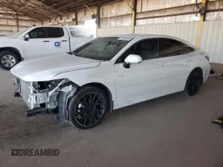 ✅ 2021 Toyota Avalon Hybrid XLE • VIN: 4T1JA1AB5MU007351 • Лот: 87248705. Опубликован ранее на Copart с пробегом 56 545 миль. Бесплатный доступ к архиву аукционных продаж из США и подробный отчёт об истории автомобиля на DreamBid. Изображение 1.