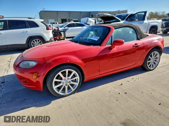 ✅ 2007 Mazda MX-5 Miata Grand Touring • VIN: JM1NC25F470133201 • Lot: 96677615. Listed on Copart with 133,243 mi. Free auction sales archive from the USA and detailed vehicle history report at DreamBid. Image 1.