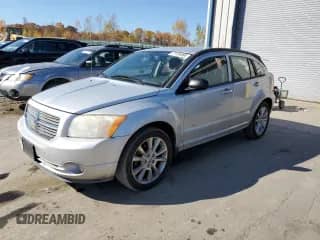 2010 Dodge Caliber Heat with VIN 1B3CB5HA9AD677531, listed as a Copart auction lot 77124894 with 157,616 mi miles and Salvage title. Bid and sale history available at DreamBid. Image 1.