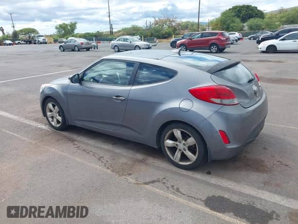 2012 Hyundai Veloster w/Black Int with VIN KMHTC6AD2CU026262, listed as a IAAI auction lot 42565828 with 115,476 mi miles and . Bid and sale history available at DreamBid. Image 3.