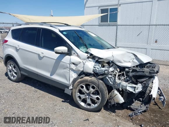 ✅ 2015 Ford Escape Titanium • VIN: 1FMCU0J98FUB63295 • Lot: 42007554. Listed on IAAI with 137,061 mi. Free auction sales archive from the USA and detailed vehicle history report at DreamBid. Image 1.