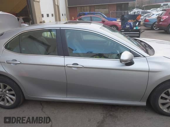 2022 Toyota Camry LE with VIN 4T1R11BKXNU066513, listed as a IAAI auction lot 41324509 with 19,488 mi miles and . Bid and sale history available at DreamBid. Image 8.