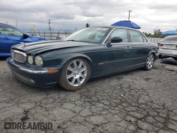 ✅ 2005 Jaguar XJ 8 LWB • VIN: SAJWA79C65SG34572 • Лот: 93790045. Опубликован ранее на Copart с пробегом 148 958 миль. Бесплатный доступ к архиву аукционных продаж из США и подробный отчёт об истории автомобиля на DreamBid. Изображение 1.