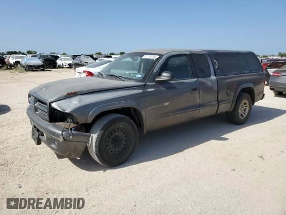 2002 Dodge Dakota with VIN 1B7GL12X32S716758, listed as a Copart auction lot 61710754 with 265,494 mi miles and Salvage title. Bid and sale history available at DreamBid. Image 1.