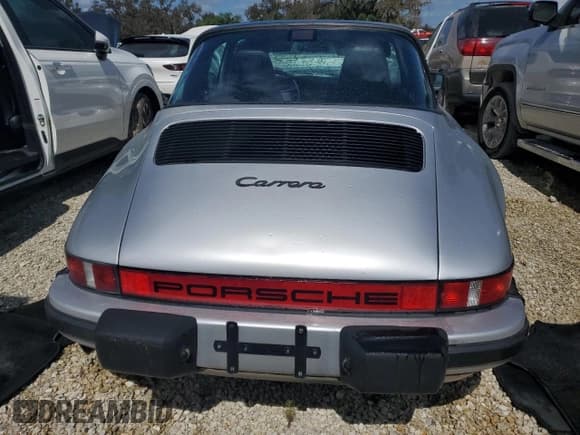 ✅ 1986 Porsche 911 • VIN: WP0EB0917GS161455 • Lot: 74672764. Wystawiony na Copart z przebiegiem 80 076 mil. Bezpłatny archiwum sprzedaży aukcyjnych z USA i szczegółowy raport historii pojazdu na DreamBid. Zdjęcie 6.