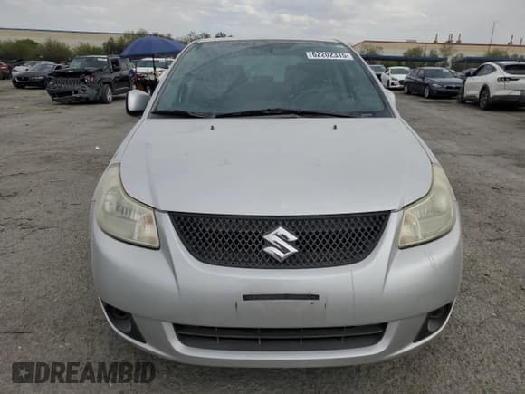 ✅ 2013 Suzuki SX4 LE • VIN: JS2YC5A35D6101897 • Лот: 62202315. Опубликован ранее на Copart с пробегом 120 532 миль. Бесплатный доступ к архиву аукционных продаж из США и подробный отчёт об истории автомобиля на DreamBid. Изображение 5.