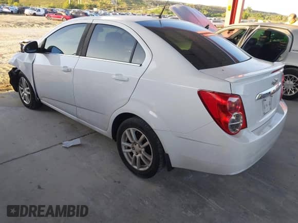 2014 Chevrolet Sonic LT with VIN 1G1JC5SG9E4127762, listed as a IAAI auction lot 43521388 with 128,333 mi miles and . Bid and sale history available at DreamBid. Image 3.