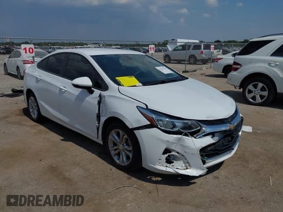 ✅ 2019 Chevrolet Cruze LS • VIN: 1G1BC5SM1K7110801 • Lot: 43252138. Listed on IAAI with 126,551 mi. Free auction sales archive from the USA and detailed vehicle history report at DreamBid. Image 1.